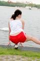 Enni having a good time outdoor wearing sexy shiny nylon shorts and a top posing for the camera (Pics)