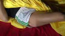 Sandra preparing her shiny nylon bed wearing sexy shiny nylon shorts and a top (Video)