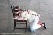 Stella tied hard to chair PICS