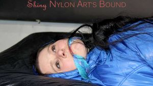 Lucy wearing sexy lightblue downwear tied and gagged with ropes and cloth gag on a bed (Pics)