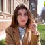 Anastasia is answering the questions while smoking 120mm on public