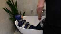 Myxxxy surprised by an Intruder in her Bathroom finally bound and gagged in Rainwear
