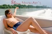 Stella and Leonie on a boat wearing sexy shiny nylon shorts and bikini tops (Pics)