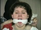 19 Yr OLD JENNIFER IS MOUTH STUFFED, TAPE GAGGED, TIED WITH ARMS OUT AND TO 2 PILLARS & CLEAVE GAGGED (D48-10)d, bondage