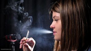 Side view of smoking 100mm cigarette