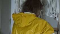 Pia wearing sexy yellow shiny nylon rainwear cleaning up the studio (Video)