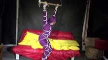 Watching sexy Sonja wearing a supersexy purple shiny nylon rainwear combination being tied and gagged overhead with ropes and a clothgag (Video)