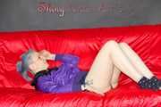 Mara wearing a sexy purple shiny nylon shorts (selfmade) and a rain jacket during preparing her sofa (Pics)