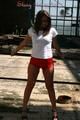 Stella posing outdoor wearing a supersexy red shiny nylon shorts and a white top (Pics)