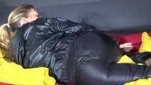 Sexy Sandra wearing sexy shiny nylon rainwear lolling in bed of nylon (Pics)