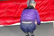 Mara wearing a sexy purple shiny nylon shorts (selfmade) and a rain jacket during preparing her sofa (Pics)