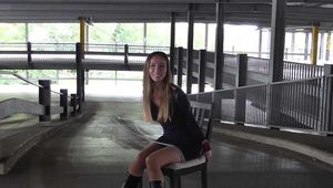Stella on chair at car park 1/2