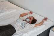 Spread eagle on bed