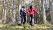 Sebastien breathplay tied up in a puffer jacket among the trees.