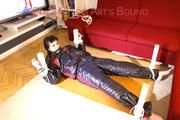 Mara tied and gagged on a bottom-up table wearing a supersexy black/red downwear combination (Pics)