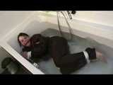 Watch Maggy beeing bound and gagged in a bathtube wearing a shiny nylon Skisuit from our Archives 2012