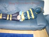 Leoni tied, gagged and hooded with tape wearing a sexy blue rainwear combination (Pics)