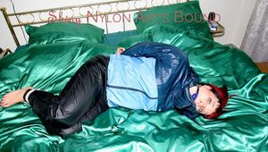 Jill tied, gagged and double hooded on a bed wearing supersexy oldschool rainwear (Pics)