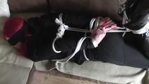 Angi hogtied on couch 2/2
