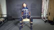Marie bound and gagged in shiny nylon Rainwear