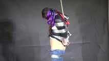 Poor Marie bound and gagged in a shiny nylon Windbreaker