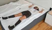 Spread eagle on bed