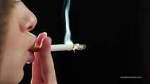 A young lady showing her smoking skills in a closeup video 