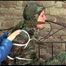 Pia tied, gagged and hooded in a princess bed wearing a sexy shiny camouflage rainwear (Video)