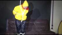 MARA tied and gagged overhead with ropes and a ballgag wearing a super sexy super shiny black rain pants, rubber boots and a yellow down jacket (Video)