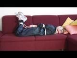 03:06 Min. video with Nina tied in a blue nylon rainsuit