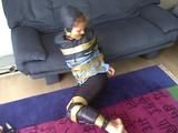 A video with one of our archive girls tied and gagged in shiny nylon rainwear