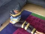 A video with one of our archive girls tied and gagged in shiny nylon rainwear