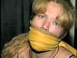 38 Yr OLD CASHIER ATTIC BOUND & GAGGED IN A BLACK LEATHER DRESS (D24-6)