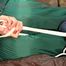 Pia tied, gagged and hooded in a princess bed wearing sexy shiny green rainwear (Pics)