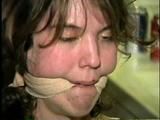 SWEET SHY HEATHER IS MOUTH STUFFED, ACE BANDAGE CLEAVE GAGGED, BAREFOOT, TOES TIED AND BOUND TO A CHAIR (D46-13)