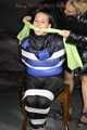 Sexy Mara wearing a black rain pants and a blue/black down jacket being tied, gagged and hooded with tape and clothgag (Pics)