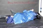 Lucy tied with cuffs overhead and gagged with a clothgag wearing sexy blue rain pants and a raincoat (Pics)