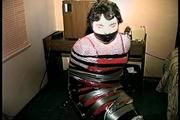 25 Yr OLD 2nd GRADE SCHOOL TEACHER IS MUMMY WRAPPED AND GAGGED WITH PLASTIC WRAP, BLACK ELECTRICAL TAPE AND SILVER DUCT TAPE ON A CHAIR (D68-13)