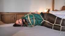 Rachel Adams tied and gagged in shiny Downwear