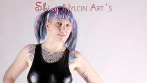 Mara wearing a sexy black shiny swimsuit and a blue shiny nylon shorts posing infront of the camera (Pics)