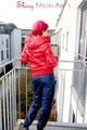 Marlin posing on a balcony wearing sexy black shiny nylon rainpants and a red down jacket (Pics)