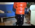 Mara sorting newspapers and lolling on the floor and the sofa wearing sexy shiny nylon downwear (Video)