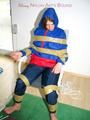 Katharina tied by using tape, gagged and hooded on a chair wearing sexy red/blue rainwear (Pics)