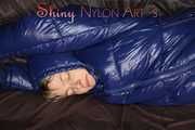 Sexy Sonja changing clothes to a brown down pants and a blue down jacket and lolling on the sofa (Pics)