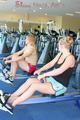 Katharina and Jenny during their workout in the fitness center wearing sexy shiny nylon shorts and tops (Pics)