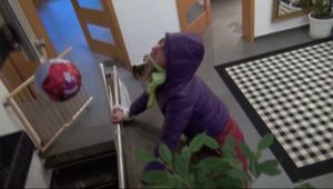 Alina tied and gagged on a commode wearing a shiny red/purple downwear combination (Video)