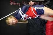 SANDRA being tied and gagged overhead with ropes and a clothgag wearing a sexy oldschool shiny nylon shorts and a rainjacket (Pics)