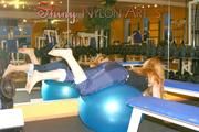 Stella and Leonie in a fitness studio wearing supersexy rainwear (Pics)
