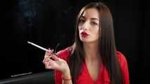Gorgeous maneater Marina is smoking a 120mm with a short cigarette holder