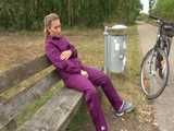 Get a Video with Sandra riding her bike enjoying her shiny nylon Rainwear